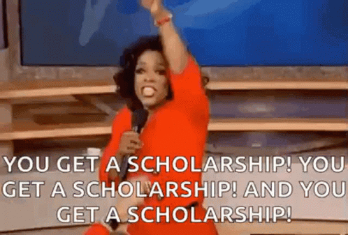 A GIF of a woman in orange with a microphone pointing to a crowd with text that says "You get a scholarship! You get a scholarship! And You get a scholarship!"